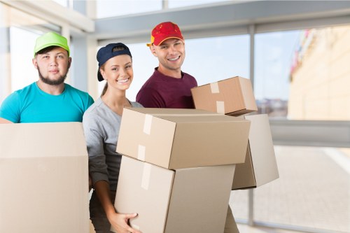 Professional removal team handling furniture during a Colindale home move