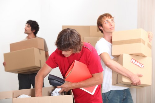Boxes and furniture prepared for a student move in Colindale