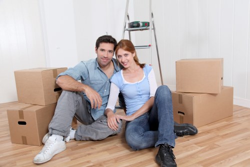 Expert movers protecting fragile items during packing and unpacking in Colindale