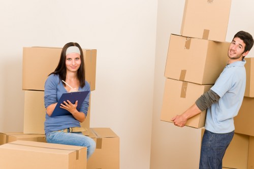 Organised storage unit space in Colindale with packed boxes